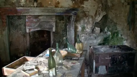 Interior of abandoned stone house in Corippo