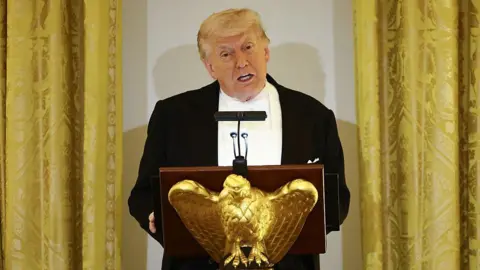 Getty Images US President Donald Trump speaks at a golden eagle lectern
