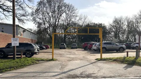 Gedling Borough Council Car park with a yellow entrance barrier