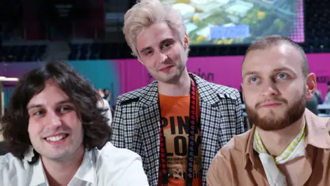 The three members of the Ukrainian band Ziferblat, wearing white, grey and brown outfits