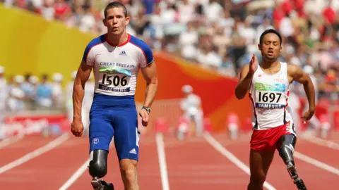 Getty Images John McFall competing at the 2008 Paralympic Games in the Men's 100m T42 Final Athletics event