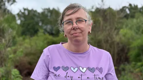 Mansfield resident Sarah Rowley at the site of the 2022 wildfire