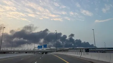 Reuters Smoke billows from Jebel Ali port following United States and Israel strikes on Iran, in Dubai, United Arab Emirates.