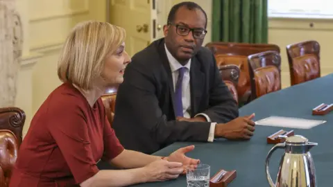 Rory Arnold / No10 Downing Street Liz truss and Kwasi Kwarteng sit at a table
