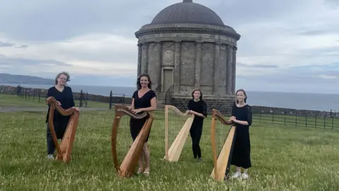 Tina Calder/Excalibur Press Harpists at Mussenden Temple