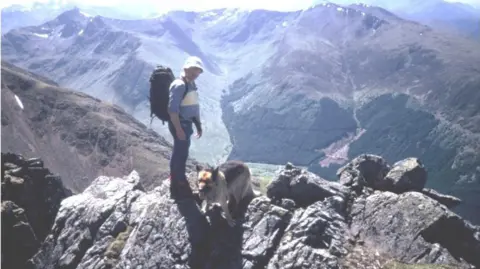 David ‘Heavy’ Whalley Heavy with his dog, Teallach, on Ben Nevis