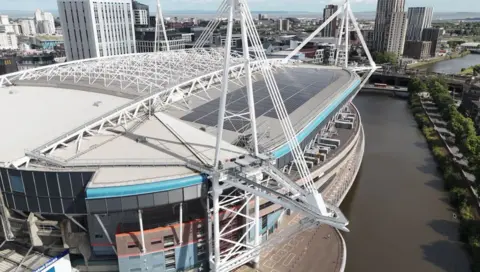 The Principality stadium on the banks of the River Taff. On its roof are new solar panels