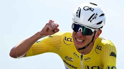 Tadej Pogacar celebrates winning stage 13 of the 2025 Tour de France