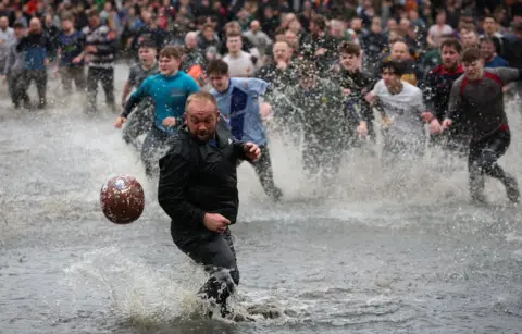 EPA-EFE/REX/Shutterstock Players in river