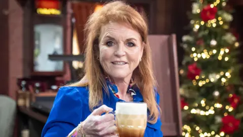 PA Media Duchess of York pulls a pint in the Rovers Return on the Coronation Street set