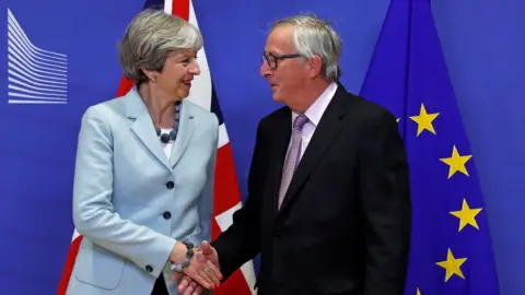 Reuters Theresa May with Jean-Claude Juncker