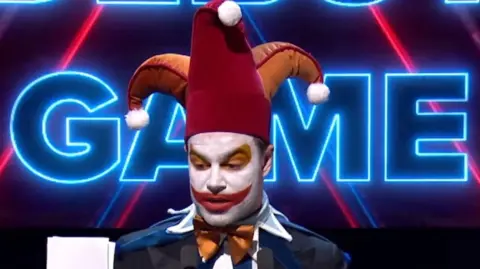 Actor Ben Starr, dressed as a jester from the game Balastro