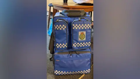 Hatton and District Community First Responders A blue bag sat on the floor by a table