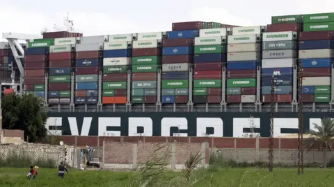 EPA The Ever Given container ship stranded in the Suez Canal, Egypt (26 March 2021)