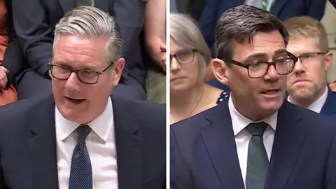 Sir Keir Starmer and Andy Burnham, both wearing dark suits and ties, white shirts and glasses, in the House of the Commons for the debate on the Hillsborough Law