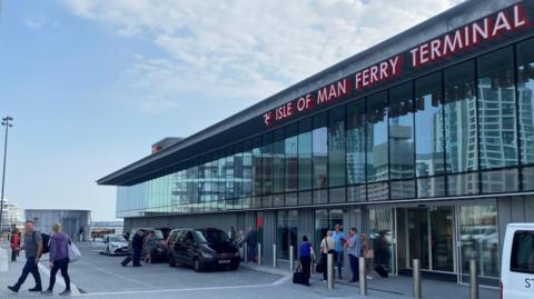 Passengers and vehicles outside the Isle of Man ferry terminal