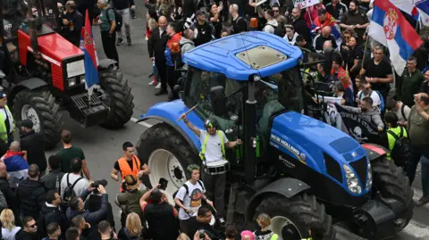 Getty Images Tractors and protesters gather during an anti-government demonstration in Belgrade, Serbia