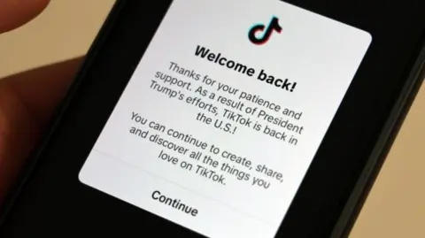 Getty Images A note on the TikTok app which says: "Welcome back! Thanks for you patience and support. As a result of President Trump's efforts, TikTok is back in the US! You can continue to create, share, and discover all the things you love on TikTok."