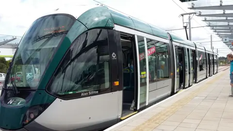 An Alstom Citadis 302 tram, part of the Nottingham Express Transit (NET) at the Toton Lane Tram stop