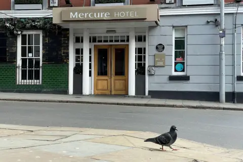 A general view of the Mercure Hotel in Nottingham city centre, with a pigeon in the foreground