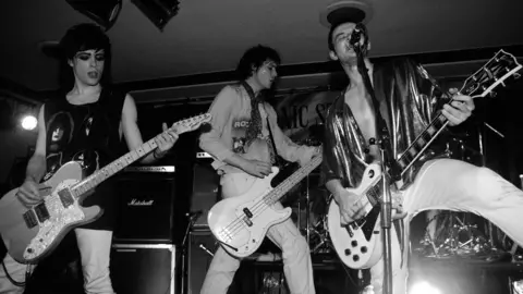 Getty Images (Left to right) Richey Edwards, Nicky Wire and James Dean Bradfield performing in 1991 before the release of the Manics' debut album Generation Terrorists