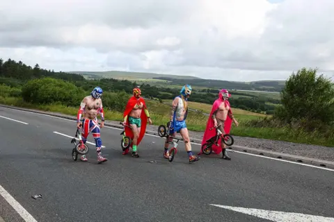 Nigel Roddis Cheerleaders in fancy dress arrive 