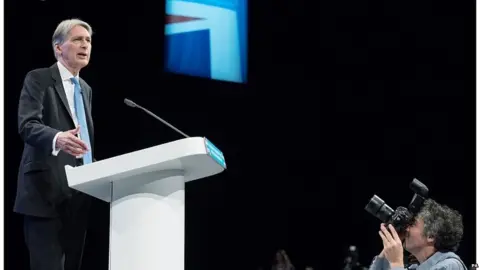 PA Philip Hammond speaking at the Conservative conference