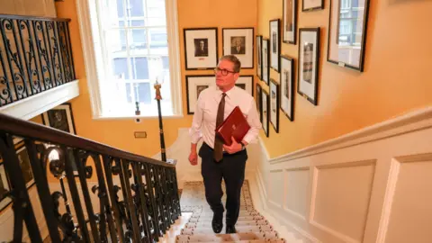 No 10 Downing Street  Prime Minister Keir Starmer on the stairs at No 10 Downing Street 