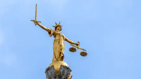 The Old Bailey - Lady Justice statue on the roof, holding a sword and some scales