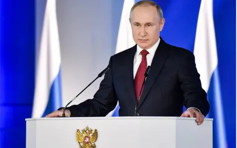 Getty Images Russia's President Vladimir Putin delivers an annual address to the Federal Assembly of the Russian Federation, at Moscow's Manezh Central Exhibition Hall on 15 Jan