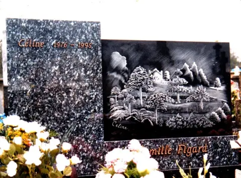 Celinen Figard's gravestone, engraved with the dates 1976-1995.  It has a black and white sculpture depicting St Andrew's church in Ombersley