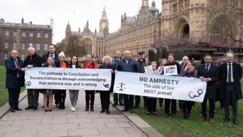 Stefan Rousseau/PA Media Members of the South East Fermanagh Foundation (SEFF) victims group unveiled banners opposing the bill