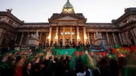 AFP Activists with green handkerchiefs, which symbolises the abortion rights movement, demonstrate to mark the revival of their campaign to legalise abortion, in front of the National Congress in Buenos Aires, on May 28, 2019