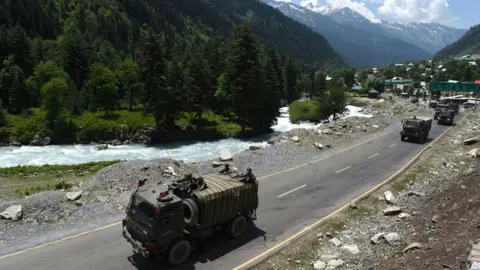Getty Images An Indian Army convoy moves along a highway leading to Ladakh, at Gagangeer on June 17, 2020 in Ganderbal, India.