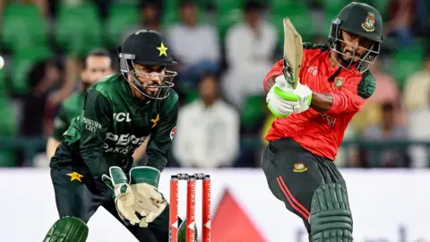 Pakistan wicketkeeper Mohammad Haris and Bangladesh batter Tanzid Hasan during their T20 series in Lahore earlier in 2025