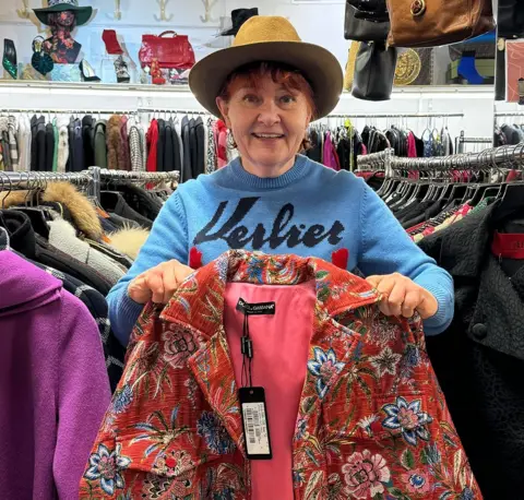 Bridget Hutchcroft Bridget holding a Dolce & Gabbana coat