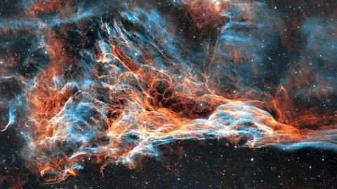 Lee Pullen/UrbanAstrophotography.com The Pickering Triangle is a collection of gasses that look like a wave, they're blue and orange coloured. 