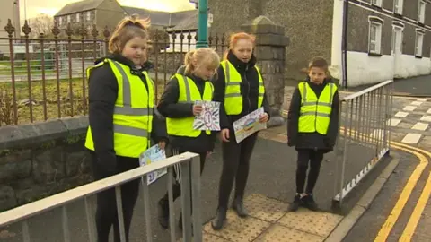 Children standing at the crossing