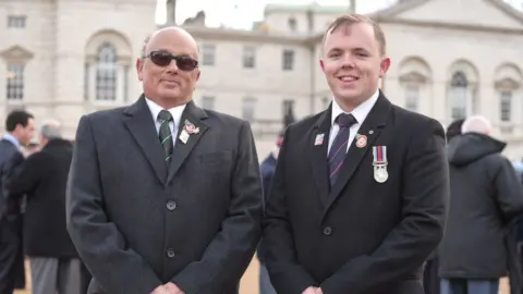 Blind veterans UK Mark Pile and his son Ben in 2017