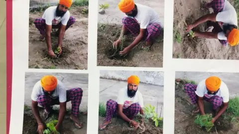 Courtesy: Chander Gaind A man poses with plant saplings before applying for a gun license