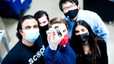 Scope Photonics Holden Beggs (centre) and team