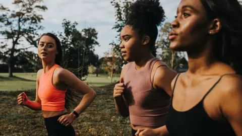 Getty Images A group running in a park