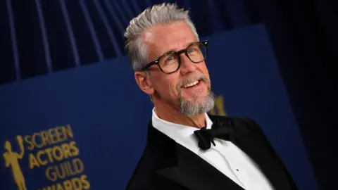 Getty Images US actor Alan Ruck arrives for the 30th Annual Screen Actors Guild awards at the Shrine Auditorium in Los Angeles, February 24, 2024.