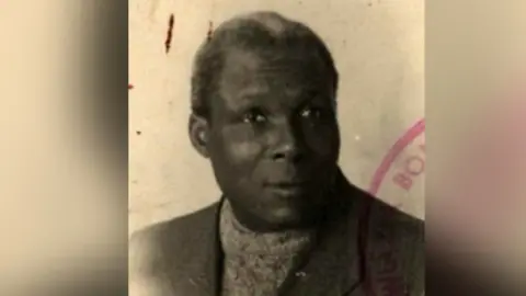 Office of Veterans and Victims of Oppression August Browne's passport photo