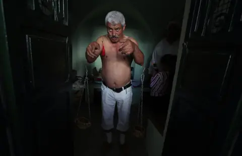 EPA A Sufi committee gathering during Kharja Issawiya in the SaÃ¯da Manoubia mausoleum in Manouba in Tunis,Tunisia on 14 October 2018. The committee is composed of men and women who gather to perform religious song and various dances to commemorate the life of the saint SaÃ¯da Manoubia who used to inhabit the region in the past.