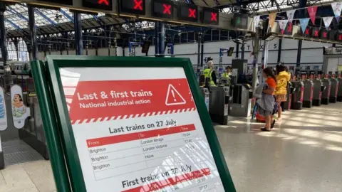 A train update board at Brighton Central station