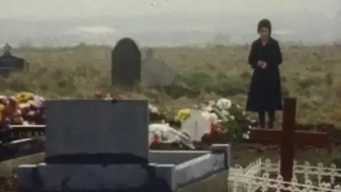 Sarah Conlon at her husband's grave