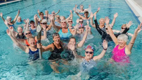 Getty Images Mary Clapperton with some local swimmers at New Cumnock pool on Monday