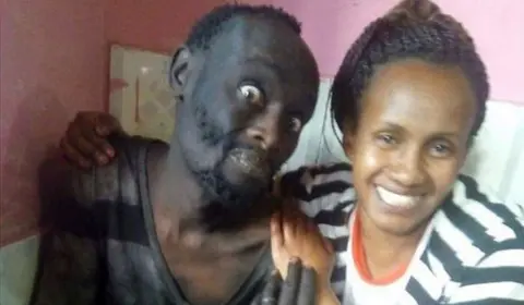 Wanja Mwaura Wanja and Hinga eat lunch together. Hinga's eyes are bulging and he looks emaciated and disturbed.