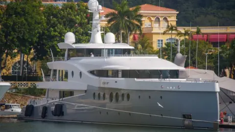 Getty Images Luxury yacht "Event", reportedly owned by Chinese property giant Evergrande boss Xu Jiayin, also known as Hui Ka Yan in Cantonese, docked at the Gold Coast Yacht & Country Club in Hong Kong.